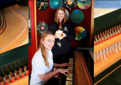 two girls at a harpsichord